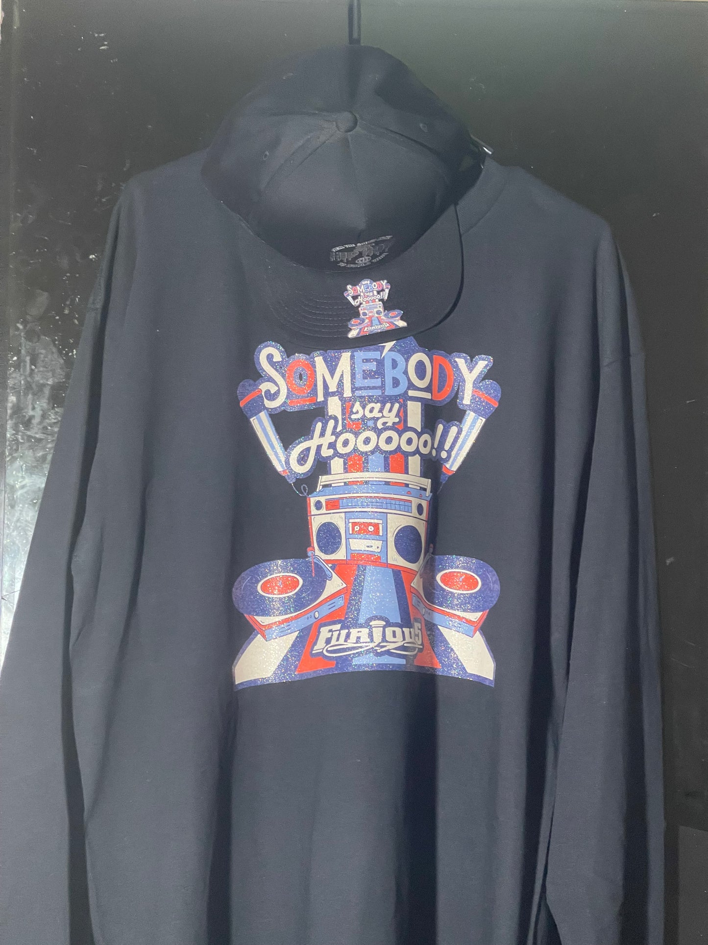 Somebody Say HOOO!™ – From the South Bronx to Worldwide Long-Sleeve Black on Black Glitter Cap includes